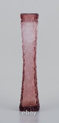 Art glass vase, Central Europe. Tall and slim vase in purple glass
