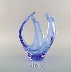 Scandinavian glass artist. Vase / bowl in light blue mouth blown art glass