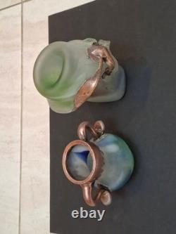 Verre d’atelier avec recouvrement en cuivre massif. Deux pièces signées par l’artiste